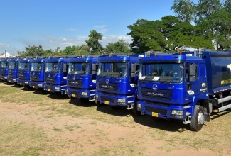 Some of the 50 new garbage trucks that the National Solid Waste Management Authority (NSWMA) received in November 2022.