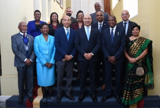 Governor-General, His Excellency the Most Hon. Sir Patrick Allen (third right), is surrounded by the new executive team of the Jamaica Employers’ Federation, led by President Wayne Chen (third left), during a courtesy call at King’s House on February 8.

