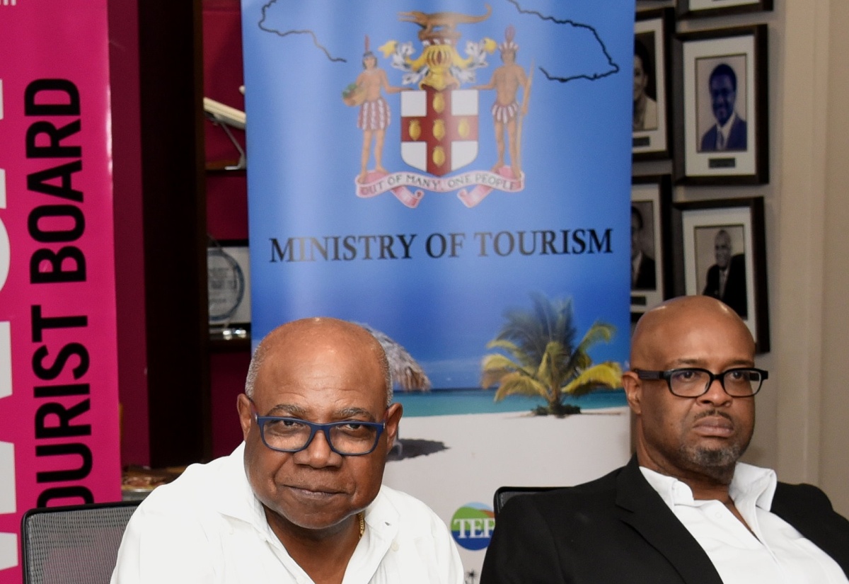 Minister of Tourism, Hon. Edmund Bartlett, addresses the Global Tourism Resilience Conference press briefing at the Jamaica Tourist Board in New Kingston on Tuesday (February 13).  Listening is Executive Director of the Global Tourism Resilience and Crisis Management Centre at the University of the West Indies, Professor Lloyd Waller.

