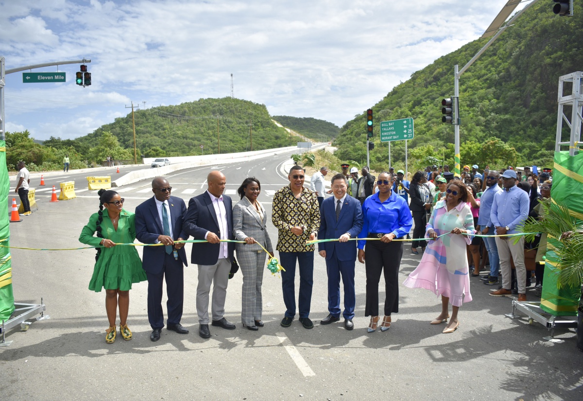 Prime Minister, the Most Hon. Andrew Holness (fourth right), cuts the ribbon to symbolise the opening of the Harbour View to Yallahs Bridge leg of the Southern Coastal Highway Improvement Project on Tuesday (February 6). Joining him are (from left) Member of Parliament (MP) for St. Thomas Eastern, Dr. Michelle Charles; Minister without Portfolio in the Ministry of Economic Growth and Job Creation (MEGJC), Hon. Everald Warmington; St. Thomas Western MP, James Robertson; Permanent Secretary in the MEGJC, Arlene Williams; Ambassador of the People’s Republic of China to Jamaica, His Excellency Chen Daojiang; MP for St. Andrew East Rural, Most Hon. Juliet Holness; and Custos of St. Thomas, Marcia Bennett.