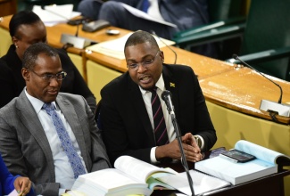 Minister without Portfolio with responsibility for Information in the Office of the Prime Minister, Hon. Robert Morgan (right), responding to questions from members of the Standing Finance Committee of the House, which is reviewing the 2024/25 Estimates of Expenditure, on March 5. At left is Minister of Finance and the Public Service, Dr. the Hon. Nigel Clarke.

