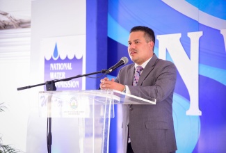 Minister Without Portfolio in the Ministry of Economic Growth and Job Creation, Senator the Hon. Matthew Samuda, delivers remarks during the recent ground-breaking ceremony for the Rio Cobre Water Treatment Plant Project in Content, St. Catherine.