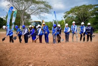 Prime Minister, the Most Hon. Andrew Holness (sixth left), breaks ground for the Rio Cobre Water Treatment Plant Project in Content, St. Catherine, on Thursday (March 14). Others participating in the exercise include National Water Commission (NWC) Chairman, Michael Shaw (third left); Member of Parliament, St. Catherine North Central, Natalie Neita Garvey (fourth left); Permanent Secretary in the Ministry of Economic Growth and Job Creation, Arlene Williams (fifth left); Cabinet Secretary, Audrey Sewell (sixth right); Deputy Prime Minister and Minister of National Security, Hon. Dr. Horace Chang (fifth right); Minister Without Portfolio in the Ministry of Economic Growth and Job Creation, Senator the Hon. Matthew Samuda (fourth right); Country Manager for Vinci Construction Grands Projects and Director of Rio Cobre Water Limited, Timothée Delebarre (third right); and NWC Vice President, Glaister Cunningham (second right).

