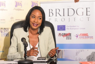 Executive Director of the non-governmental organisation, MultiCare Youth Foundation, Alicia Glasgow Gentles, speaks at a JIS Think Tank, on March 14. She noted that 300 at-risk youth in volatile communities are benefiting from targeted intervention for violence prevention, through the European Union-funded BRIDGE Project.