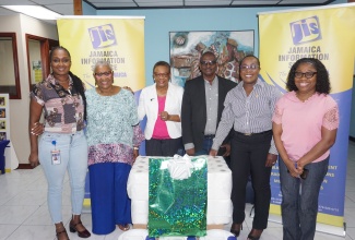 Chief Executive Officer, Jamaica Information Service (JIS), Enthrose Campbell (third left), is joined by members of the Agency’s Finance Department - Stores Officer, Maureen Green (left), Finance Manager, Glenford West (third right), and Accounts Supervisor, Nadia Spaulding-Lindo (right), after handing over donations from Action Chemical and Equipment and IJASS Trading Limited to the Mount Olivet Boys’ Home. The presentation was made the Agency’s Head Office in Kingston on March 1. Sharing the moment are Company Secretary and Director, Action Chemical and Equipment, Marva Bernard (second left), and Board Chair and Interim Director, Mount Olivet Boys’ Home, Sophia Morgan.