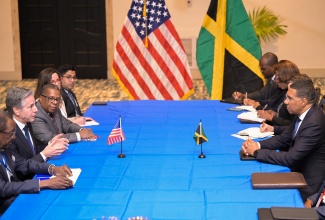 Prime Minister, the Most Hon. Andrew Holness (right), listens to remarks by United States Secretary of State, Antony Blinken (second left), during a Bilateral meeting at The Jamaica Pegasus hotel in New Kingston on Monday (March 11).

