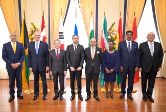 Governor-General, His Excellency the Most Hon. Sir Patrick Allen (left), pauses for a photo opportunity with Ambassadors-Designate following the Group Presentation of Credentials at King’s House on Tuesday (March 12).