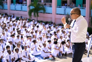 Minister of Health and Wellness, Dr. Hon. Christopher Tufton, addresses students of Immaculate Conception High School in Kingston during the handover of the institution’s newly installed ‘Wellness Bench’ on Monday (March 18).

