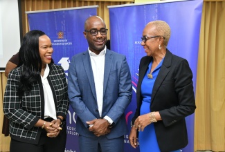 Minister of Education and Youth, Hon. Fayval Williams (right), is in discussion with Chairman, Education Transformation and Oversight Committee (ETOC),  Dr. Adrian Stokes and Permanent Secretary in the Ministry, Dr. Kasan Troupe, during a press conference at the Overseas Examinations Commission in Kingston on March 14.