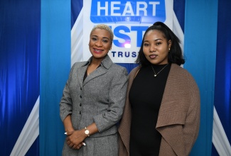 Managing Director, HEART/NSTA Trust, Dr. Taneisha Ingleton (left), shares a photo opportunity with TVET Ambassador, Melissa Moses, during Thursday’s (February 29) launch of the entity’s TVET Ambassador Programme. The launch was held at the HEART/NSTA Trust’s offices on Oxford Road in St. Andrew. 
