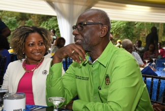 Minister of Local Government and Community Development, Hon. Desmond McKenzie (right), is in discussion with Minister without Portfolio in the Office of the Prime Minister with Oversight for Skills and Digital Transformation, Senator Dr. the Hon. Dana Morris Dixon, during the Board of Supervision’s annual awards ceremony at the Boone Hall Oasis in Stony Hill, St. Andrew, recently.

 