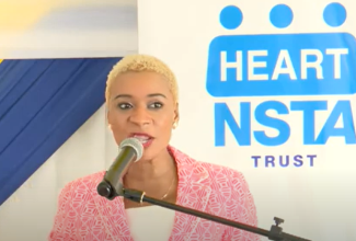 Managing Director of the HEART/NSTA Trust, Dr. Taneisha Ingleton, delivers the keynote address at the College’s Centre of Excellence Culinary Arts & Gastronomoy Symposium and Open House, held on Wednesday, March 13.

