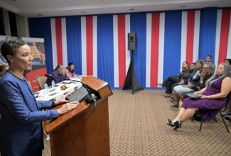 Minister of Foreign Affairs and Foreign Trade, Senator the Hon. Kamina Johnson Smith (left) addresses the audience during an event held recently at the University of the West Indies (UWI).