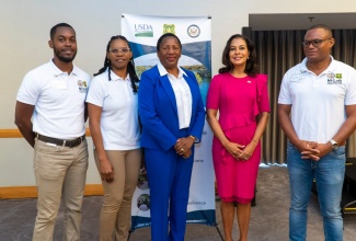 Minister of Planning and Development in Trinidad and Tobago, Hon. Pennelope Beckles-Robinson (centre), shares a photo opportunity with (from left), Executive Director, Jamaica Conservation and Development Trust (JCDT), David Walters;  Natural Infrastructure for Caribbean Resilience (NICaR) Programme Manager, Shelly-Ann Lawson Francis; United States Ambassador to Trinidad and Tobago, Candace Bond; and Executive Director, Central Jamaica Social Development Initiative, Damion Young. Occasion was an ecosystem restoration training held recently in Trinidad and Tobago.