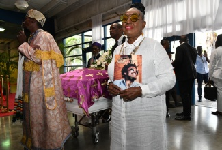 Minister of Culture, Gender, Entertainment and Sport, Hon. Olivia Grange, attends the Celebration of Life for the late Aston “Family Man” Barrett held at the National Indoor Sports Complex in Kingston on Tuesday (March 5).