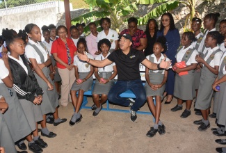 Minister of Health and Wellness, Dr. the Hon. Christopher Tufton, interacts with students and staff at the Montego Bay High School for Girls in St. James, on Friday (March 8), as part of the Government’s School Mental Health Literacy Programme and the #DoYourShare mental health campaign.

