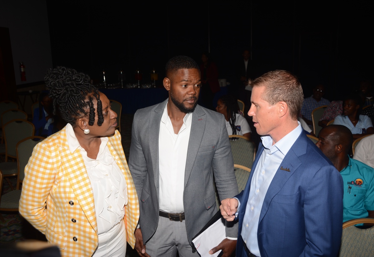 Mayor of Montego Bay, Richard Vernon (centre), interacts with Founder and Chairman of the Jill Stewart MoBay City Run, Janet Silvera (left), and Executive Chairman of Sandals Resorts International, Adam Stewart, during the launch of the Jill Stewart MoBay City Run at the Holiday Inn in Rose Hall, St. James, on Wednesday (March 13).