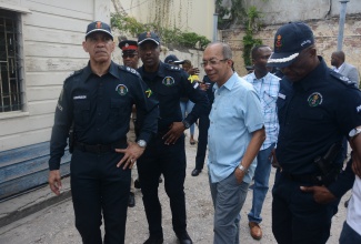 Deputy Prime Minister and Minister of National Security, Hon. Dr. Horace Chang (second right), is joined by (from left) Police Commissioner, Major General Antony Anderson; Commanding Officer, St. James Police Division, Senior Superintendent Vernon Ellis, and Head, Area One Police, Assistant Commissioner Clifford Chambers, during a tour of the Barnett Street Police Station in downtown Montego Bay on Saturday (March 16).
