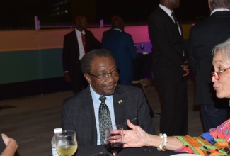 From left: Minister of Foreign Affairs and Foreign Trade, Senator the Hon. Kamina Johnson Smith (left), and Ambassador of the United States to Jamaica, Nick Perry, listen to Island Grill Founder and Chair of the National Commercial Bank Foundation (NCBF), Dr. Thalia Lyn, at the Diplomatic Days 2024 welcome reception on March 12, at the Ministry’s Port Royal Street offices in Kingston.

