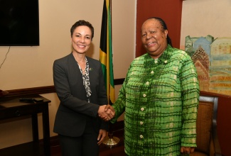 South Africa’s Minister of International Relations and Cooperation, Dr. Grace Naledi Mandisa Pandor (right), is welcomed to the island by Minister of Foreign Affairs and Foreign Trade, Senator the Hon. Kamina Johnson Smith, on her arrival at the Norman Manley International Airport on Wednesday, March 20. 

