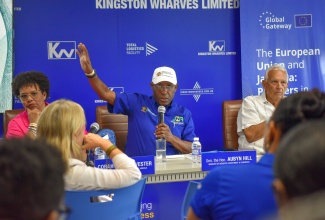 Minister of Industry, Investment and Commerce, Senator the Hon. Aubyn Hill (centre), addresses a business forum attended by private sector investors, officials from the European Investment Bank, and personnel from the European Union (EU), held recently at the Total Logistics Facility, in Newport West, Kingston.