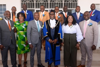 Mayor of Portmore, His Worship Leon Thomas (third right, front row), is surrounded by newly installed Councillors of the Portmore Municipal Corporation during the swearing-in ceremony at Lot 1 Cookson Pen, Braeton Parkway, Greater Portmore, on March 12.