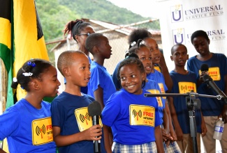 Students from the Medina Primary School showcase their talent in song, at the launch of free secured Wi-Fi service by the Universal Service Fund (USF), at the Freetown community centre in Manchester on Wednesday (March 20).  