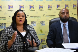 Chief Executive Officer, Child Protection and Family Services Agency (CPFSA), Laurette Adams-Thomas (left), makes a point during a recent Jamaica Information Service Think Tank at the agency’s head office in Kingston. Listening is Director of Children and Family Programmes, CPFSA, Dr. Warren Thompson.

