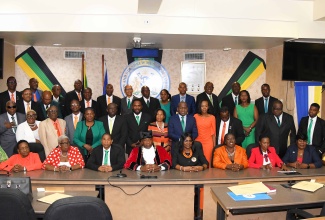 Newly installed Mayor of Kingston, Councillor Andrew Swaby (fifth left), and Deputy Mayor, Senator Councillor Delroy Williams (fourth left), with Councillors representing Divisions across the Kingston and St. Andrew Municipal Corporation (KSAMC). The occasion was Tuesday’s (March 12) Statutory Meeting for the Declaration of KSAMC Councillors and selection of the Mayor and Deputy Mayor of Kingston at the Corporation’s offices on Church Street in downtown Kingston.

