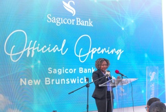 Minister without Portfolio in the Office of the Prime Minister, with responsibility for Skills and Digital Transformation, Senator Dr. the Hon. Dana Morris Dixon, addresses the opening of Sagicor Bank’s New Brunswick Branch in St. Catherine on Tuesday (March 19).