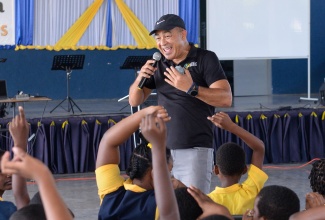 Minister of Health and Wellness, Dr. the Hon. Christopher Tufton, engages with students at Christel House Jamaica, during a wellness check-In at the institution in St. Catherine on Wednesday (March 13), as part of the Ministry’s #DoYourShare mental wellness campaign.

