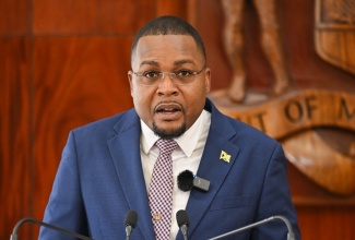 Minister without Portfolio in the Office of the Prime Minister with responsibility for Information, Hon. Robert Morgan, addressing Wednesday’s (March 13) post-Cabinet press briefing at Jamaica House.