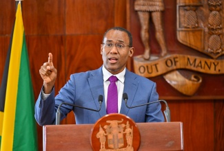 Minister of Finance and the Public Service, Dr. the Hon. Nigel Clarke, responds to a question posed during today’s (March 13) post-Cabinet press briefing at Jamaica House.