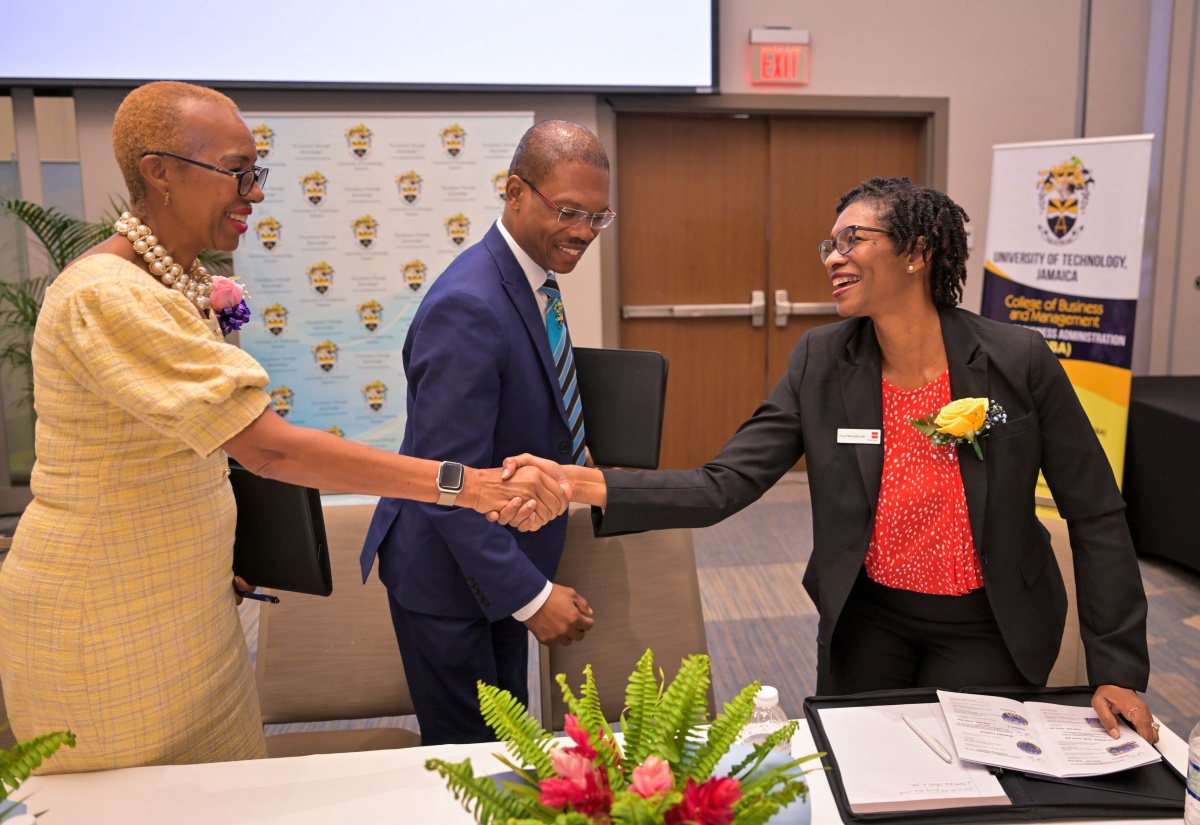 Minister of Education and Youth, Hon. Fayval Williams (left), greets Head of the Association of Chartered Certified Accountants (ACCA) Caribbean, Paula Marcelle Irish. The event was the University of Technology (UTech) 15th Annual Students Accounting Seminar held on March 21 at the AC By Marriot Hotel in Kingston. President of Utech, Dr. Kevin Brown, is at centre.