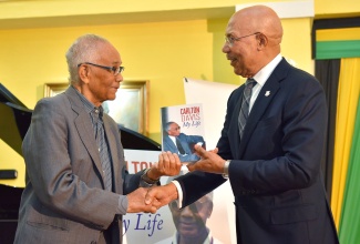 Governor- General, His Excellency the Most Hon. Sir Patrick Allen (right) is presented with a copy an autobiography entitled ‘My Life’ by former Cabinet Secretary, Dr. Carlton Davis, at a book launch held on March 7 at King’s House.

 