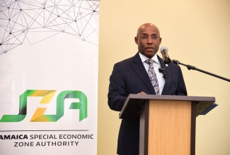 Minister of Industry, Investment and Commerce, Senator the Hon. Aubyn Hill, delivers remarks during the final Jamaica Special Economic Zone Authority (JSEZA) ‘SEZ Unplugged’ workshop, hosted at the Courtyard by Marriott Kingston Hotel on March 13.