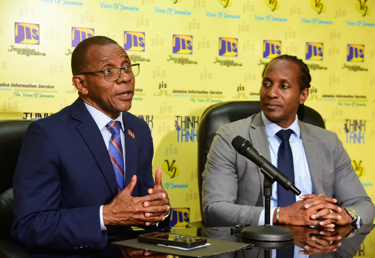 Minister of State in the Ministry of Foreign Affairs and Foreign Trade, Hon. Alando Terrelonge (right), listens to Chair of the Biennial Diaspora Conference, President and Chief Executive Officer (CEO), VM Group, Courtney Campbell, at a Jamaica Information Service Think Tank, held on April 25 at the Agency’s head office, in Kingston. 