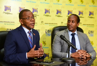 Minister of State in the Ministry of Foreign Affairs and Foreign Trade, Hon. Alando Terrelonge (right), listens to Chair of the Biennial Diaspora Conference, President and Chief Executive Officer (CEO), VM Group, Courtney Campbell, at a Jamaica Information Service Think Tank, held on April 25 at the Agency’s head office, in Kingston. 