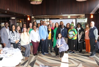 Minister of Tourism, Hon. Edmund Bartlett (eighth left), shares a photo opportunity with top travel agents from Baltimore and Philadelphia at a luncheon hosted by the Jamaica Tourist Board (JTB) in Baltimore, Maryland, on Friday, April 12. 
