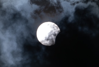The Jamaica Information Service (JIS) captured a shot of the solar eclipse in the Kingston skies at about 2:30 p.m. on Monday (April 8). The full eclipse swept across North America, plunging sections of the United States, Canada and Mexico into darkness for about four minutes as the moon came directly between the Earth and the sun, completely blocking the light of the sun.  Jamaica and other Caribbean countries experienced a partial eclipse, where only a part of the sun was covered.

