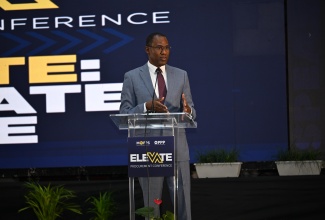 Minister of Finance and the Public Service, Dr. the Hon. Nigel Clarke, addressing the Elevate Procurement Conference at the Montego Bay Convention Centre in Rose Hall, St. James, on Tuesday (April 23).