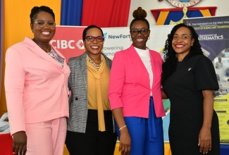 State Minister in the Ministry of Education and Youth, Hon. Marsha Smith (right), pictured with (from left) Chief Education Officer in the Ministry, Terry-Ann Thomas Gayle; Permanent Secretary in the Ministry, Dr. Kasan Troupe; and Mathematics Teacher of the Year 2024, of Green Pond Primary School, Cameka Ingram. Event was the Mathematics Teacher of the Year and Jamaican Mathematical Olympiad (JMO) Awards ceremony, held on April 15 at the University of the West Indies (UWI), Mona campus, in Kingston.