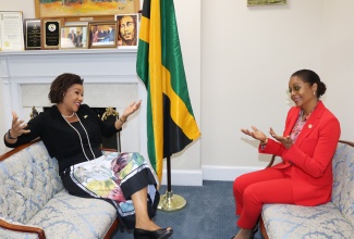 Minister of Legal and Constitutional Affairs, Hon. Marlene Malahoo Forte (right), and Jamaica’s Ambassador to the United States, Her Excellency Audrey Marks, engage in light conversation just before the start of the ‘Let’s Connect’ town hall at the Embassy of Jamaica in Washington DC on Wednesday evening (April 17). Minister Malahoo Forte engaged members of the disapora on the constitutional reform process and the move towards a republic.
