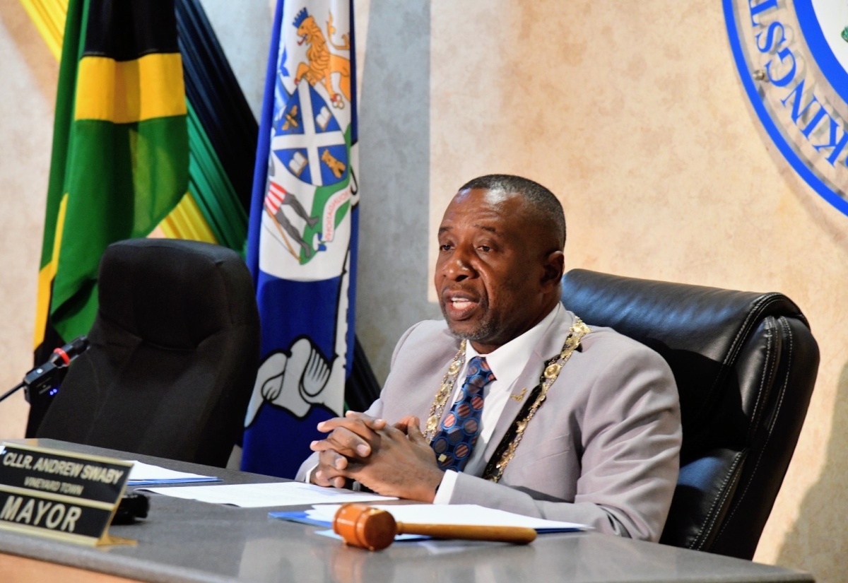 Mayor of Kingston, Councillor Andrew Swaby, addresses today’s (April 9) monthly meeting of the Kingston and St. Andrew Municipal Corporation (KSAMC), at  24 Church Street in downtown Kingston.