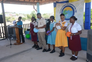 Manager of the Tourism Information Centre, Jamaica Tourist Board (JTB), Lucretia Green (lectern), does a presentation on ‘the Colours of Tourism’, while students with coloured balloons highlight the various aspects of the sector. Occasion was the Tourism Product Development Company Limited (TPDCo) Youth Expo and Career Fair at the Breds Treasure Beach Sports Park in St. Elizabeth on Thursday (April 11).

