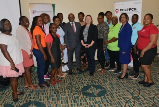 Minister of Industry, Investment and Commerce, Senator the Hon. Aubyn Hill (eighth left); High Commissioner for Canada to Jamaica, Her Excellency Emina Tudakovic (seventh right); and Permanent Secretary in the Ministry, Sancia Bennett Templer (third right), share a photo opportunity with participants in the Women in Entrepreneurship Support (WES) project, at the closing ceremony held on April 18 at the Courtyard by Marriott Hotel in Kingston.  The WES Project was initiated by MIIC in partnership with the Ministry of Culture, Gender Entertainment and Sport through the Bureau of Gender Affairs. The objective was to provide capacity-building, technical assistance and financial support to women-owned micro, small and medium-sized enterprises (MSMEs) by boosting their ability to scale their operations, become formal businesses and increase their potential for additional business opportunities.

