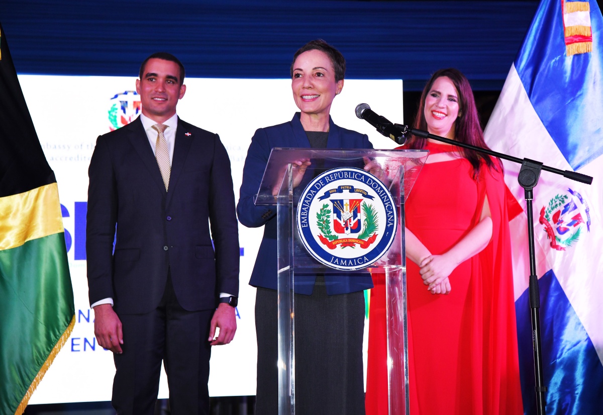 Minister of Foreign Affairs and Foreign Trade, Senator the Hon. Kamina Johnson Smith, addresses the Dominican Week gala reception at the Dominican Republic Ambassador’s official residence in Kingston on Thursday (April 18). Listening are Ambassador of the Dominican Republic to Jamaica, Her Excellency, Angie Martinez, and the country’s Vice Minister of Bilateral Foreign Policy, José Julio Gómez.