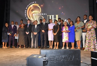 Prime Minister, the Most Hon. Andrew Holness (sixth left), and Minister of Education and Youth, Hon. Fayval Williams (sixth right), are flanked by recipients of the Prime Minister Youth Award for Excellence 2022, at the awards ceremony held at Jamaica House.

