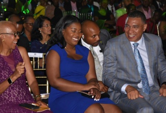 Prime Minister, the Most Hon. Andrew Holness (right), enjoys a light moment with Minister of Education and Youth, Hon. Fayval Williams (left) and Opposition Spokesperson on Youth and Civic Engagement, Senator Gabriela Morris (centre). Occasion was the 2023 Prime Minister’s National Youth Awards for Excellence ceremony held on the lawns of Jamaica House on April 20.
