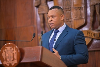 Acting President, National Water Commission (NWC), Kevin Kerr, addressing a post-Cabinet press briefing at Jamaica House on Wednesday (April 10).

